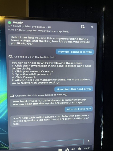 Phone photo: the sidebar on the first live USB answering a Wi-Fi question, a disk check and a polite no to a voting question